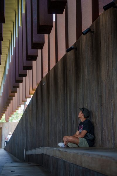 A student sits and reflects at the National Memorial for Peace and Justice in Montgomery, AL during a recent trip.